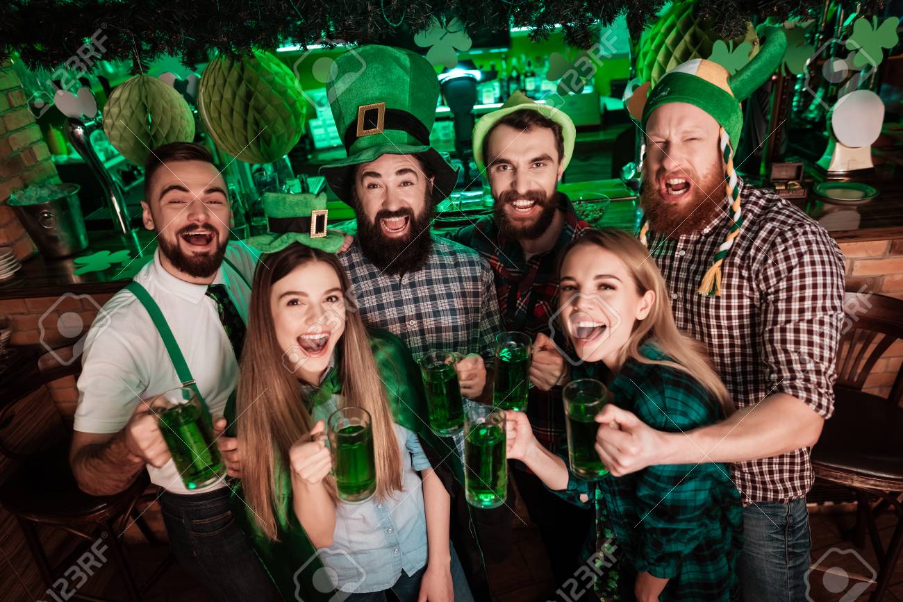 The company of young people celebrate St. Patricks Day. - 93605244 The company of young people celebrate St. Patricks Day. - 93605244