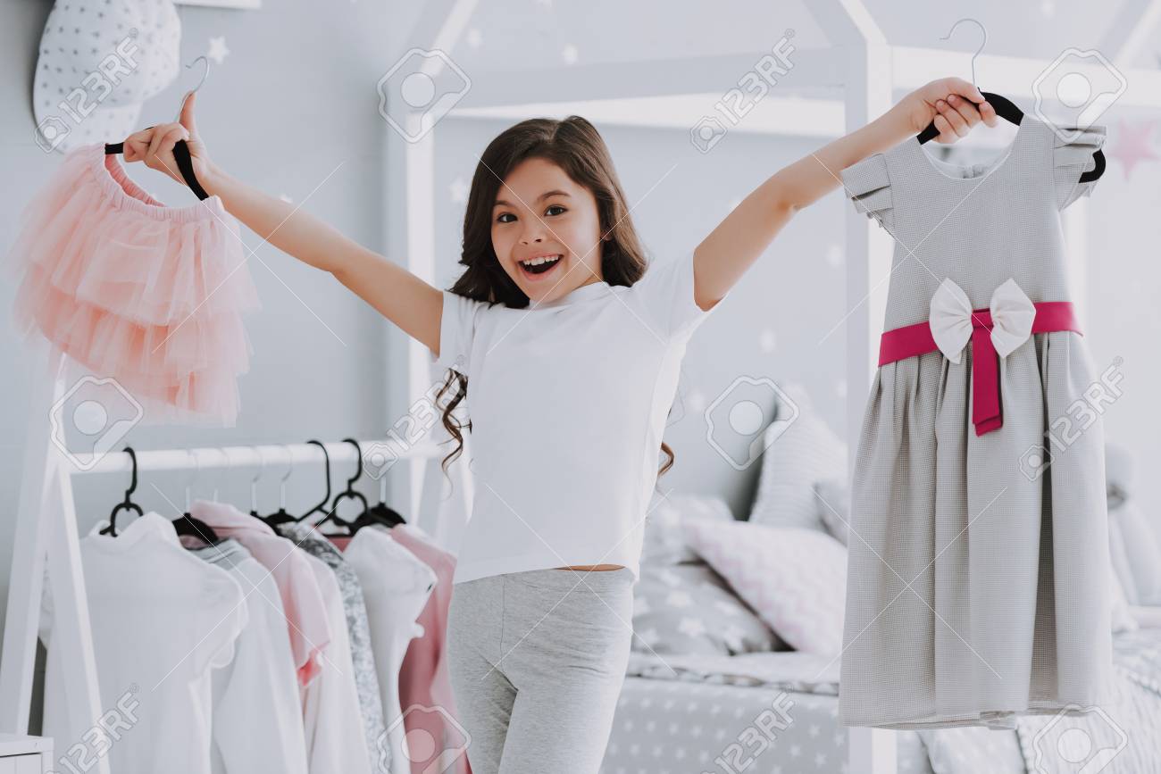 Little Cute Girl Choosing A Dress In Bedroom Pretty Little Happy