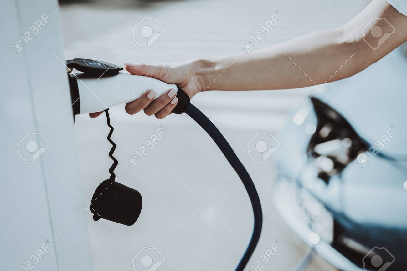 Car Cable Plug In A Socket. Automobile Charging Station Concept. Innovation Technology. New Generation Electro Hybrid Vehicle Plugin. Ecology Charge Station. Futuristic Power. - 107994277 Car Cable Plug In A Socket. Automobile Charging Station Concept. Innovation Technology. New Generation Electro Hybrid Vehicle Plugin. Ecology Charge Station. Futuristic Power. - 107994277