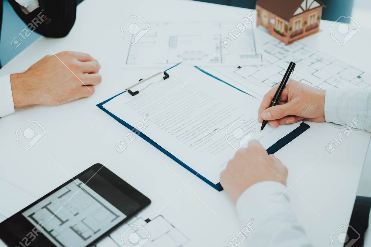 Close-up. Contract Signing Concept. Property Buy. Bright Office. Business Meeting. Customer And Buyer. Offer Discussion. Professional Agreement. House Selling Proposal. Document Signature. - 110179073 Close-up. Contract Signing Concept. Property Buy. Bright Office. Business Meeting. Customer And Buyer. Offer Discussion. Professional Agreement. House Selling Proposal. Document Signature. - 110179073