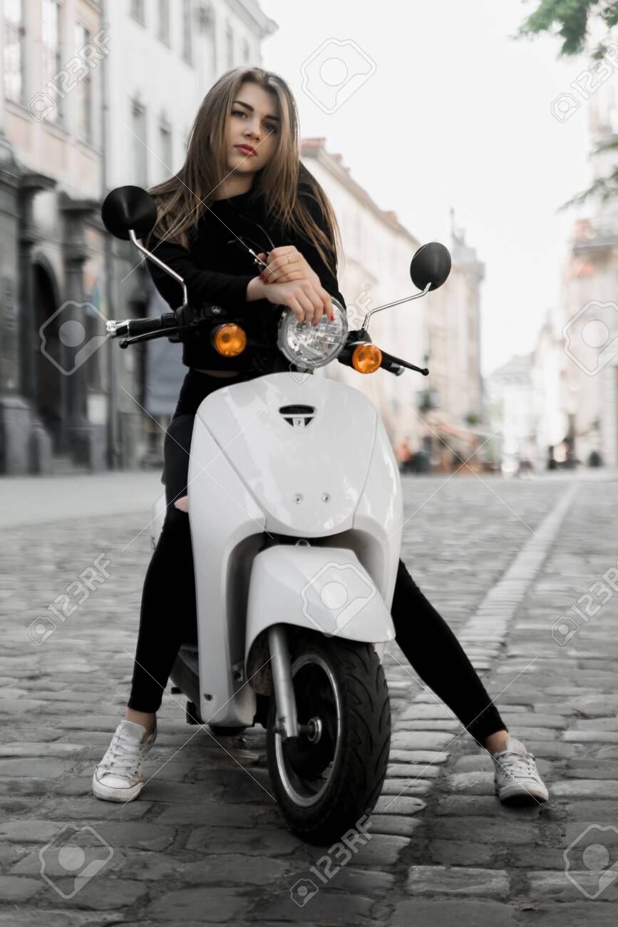girl riding moped