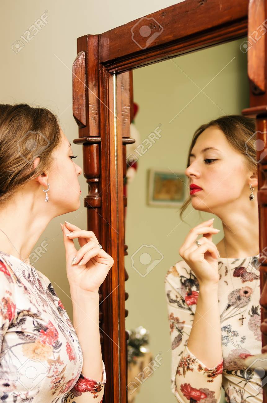 The Girl In A Beautiful Dress Looks In The Mirror Picture Was Taken In The Interior Of A Private House Stock Photo Picture And Royalty Free Image Image The Girl In A Beautiful Dress Looks In The Mirror Picture Was Taken In The Interior Of A Private House Stock Photo Picture And Royalty Free Image Image