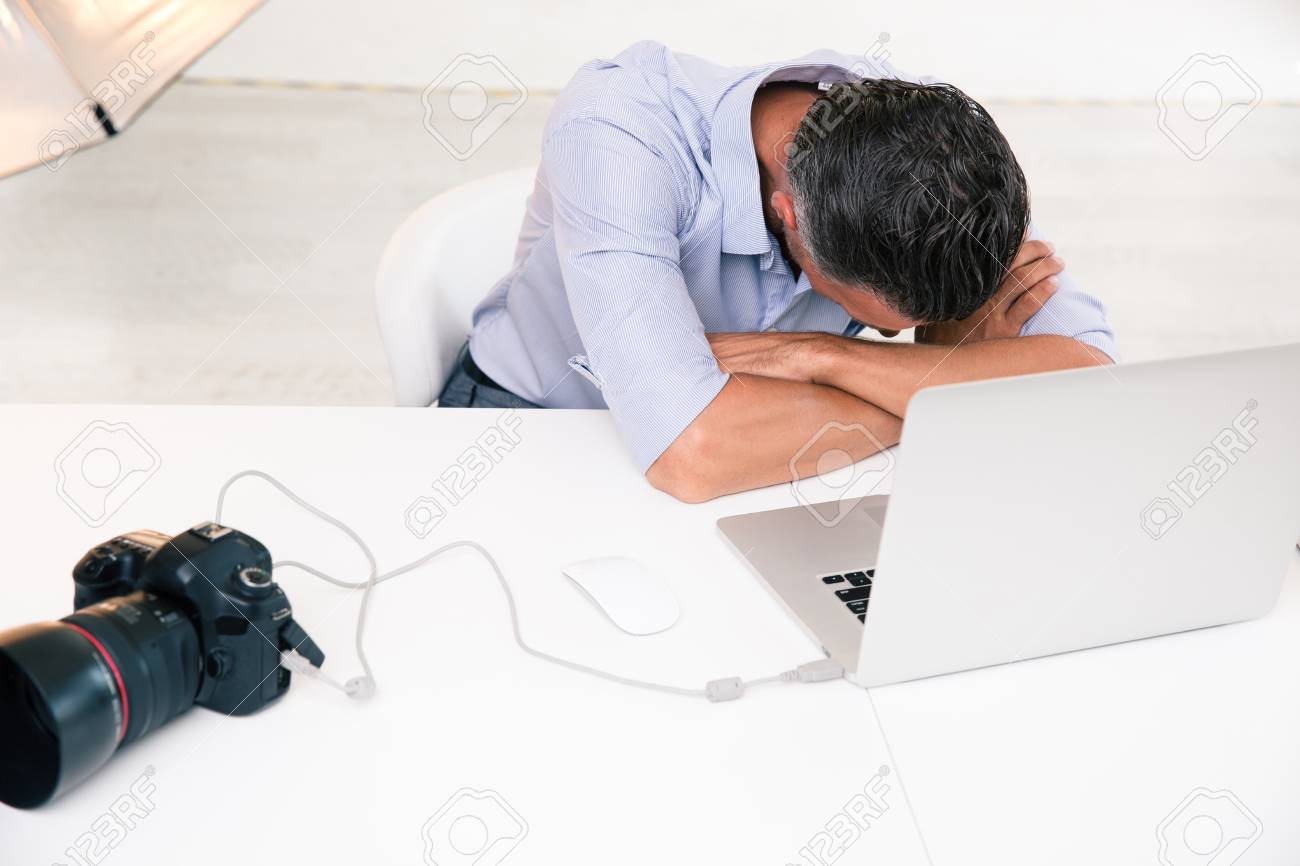 Photographer Sleeping At His Workplace In Studio Stock Photo, Picture And Royalty Free Image. Image 44601010.