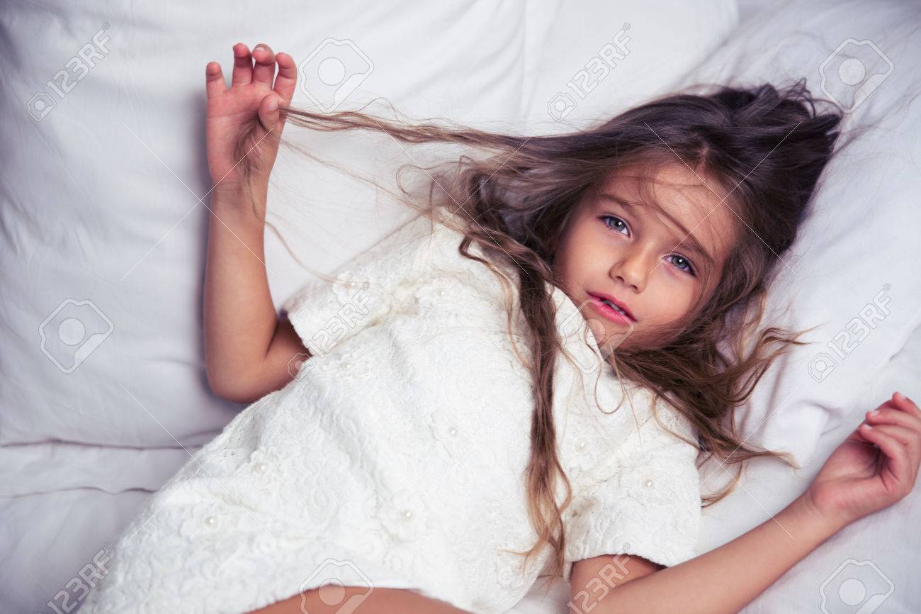 little girl on bed