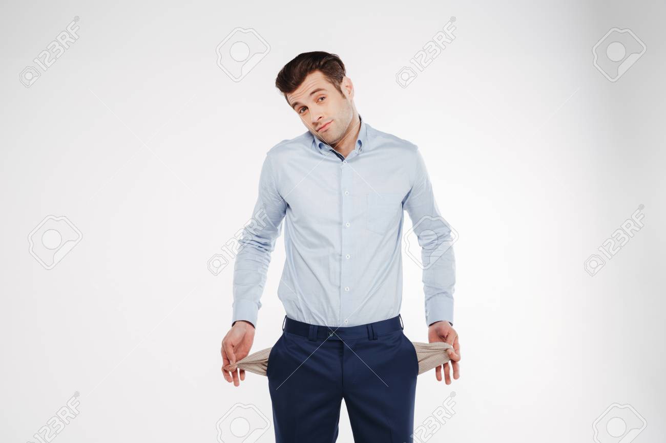 Upset Man In Business Clothes Which Showing Empty Pockets And Looking At  Camera. Isolated White Background Stock Photo, Picture And Royalty Free  Image. Image 76317291.