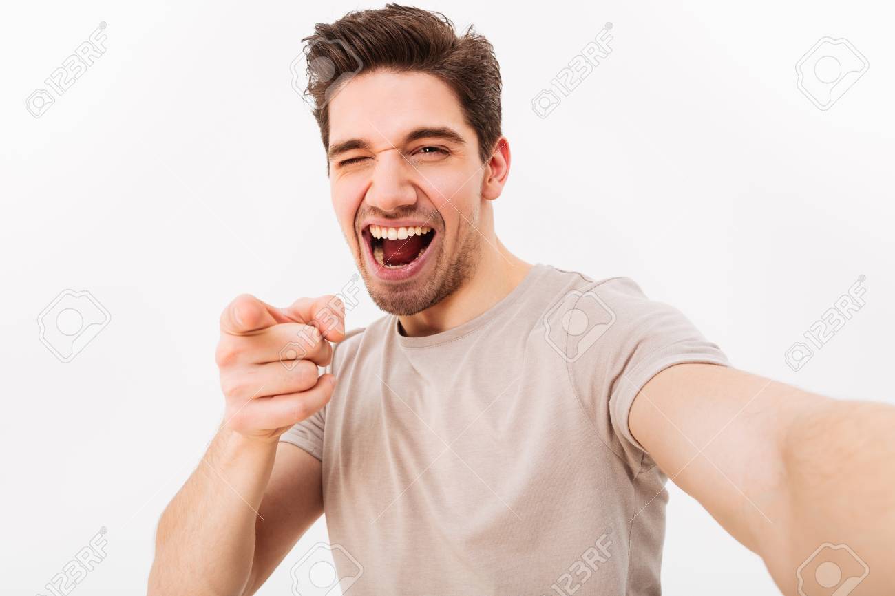 Joyful Man With Brown Hair Gesturing Index Finger On Camera