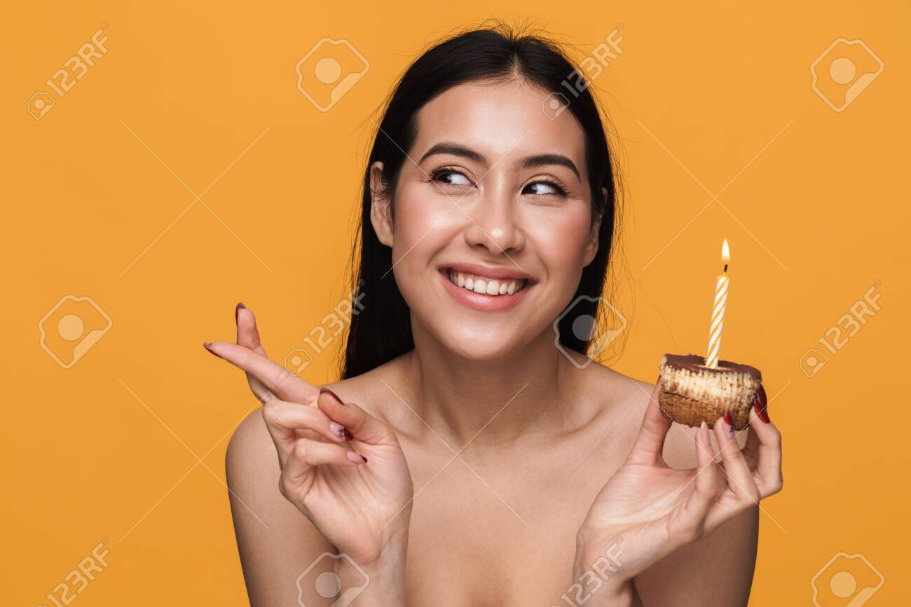 Beauty Portrait Of Caucasian Young Brunette Half-naked Woman Celebrating  Holiday And Holding Birthday Cake Isolated Over Yellow Background Stock  Photo, Picture and Royalty Free Image. Image 146437641.