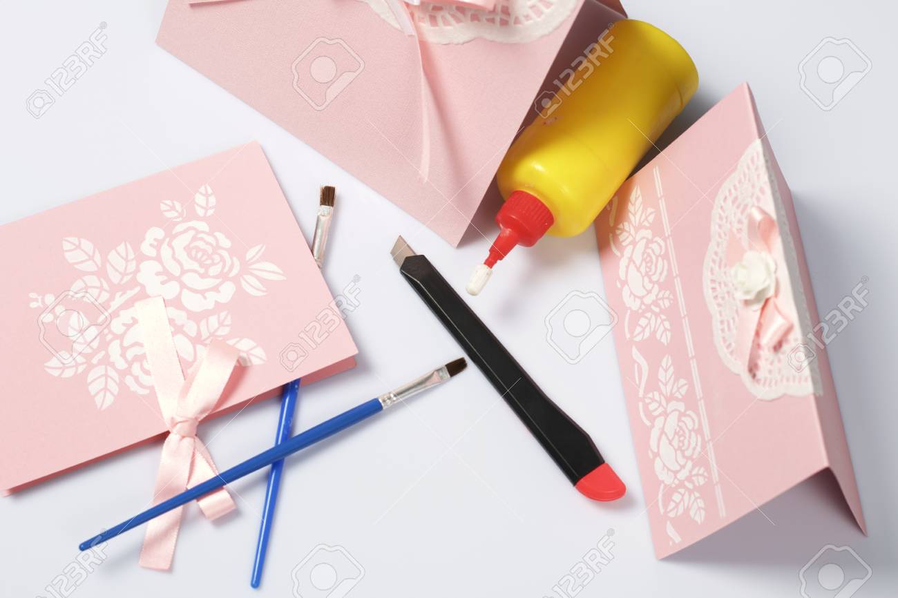 making greeting cards from paper cardboard and tape nearby making greeting cards