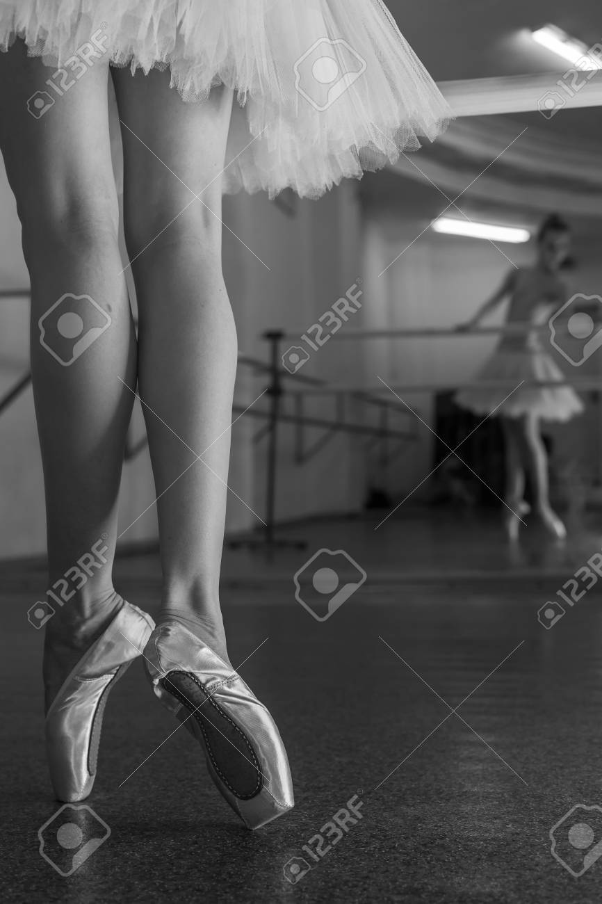 Ballerina In Pointe Shoes And Tutu Standing On Toes At The Bench