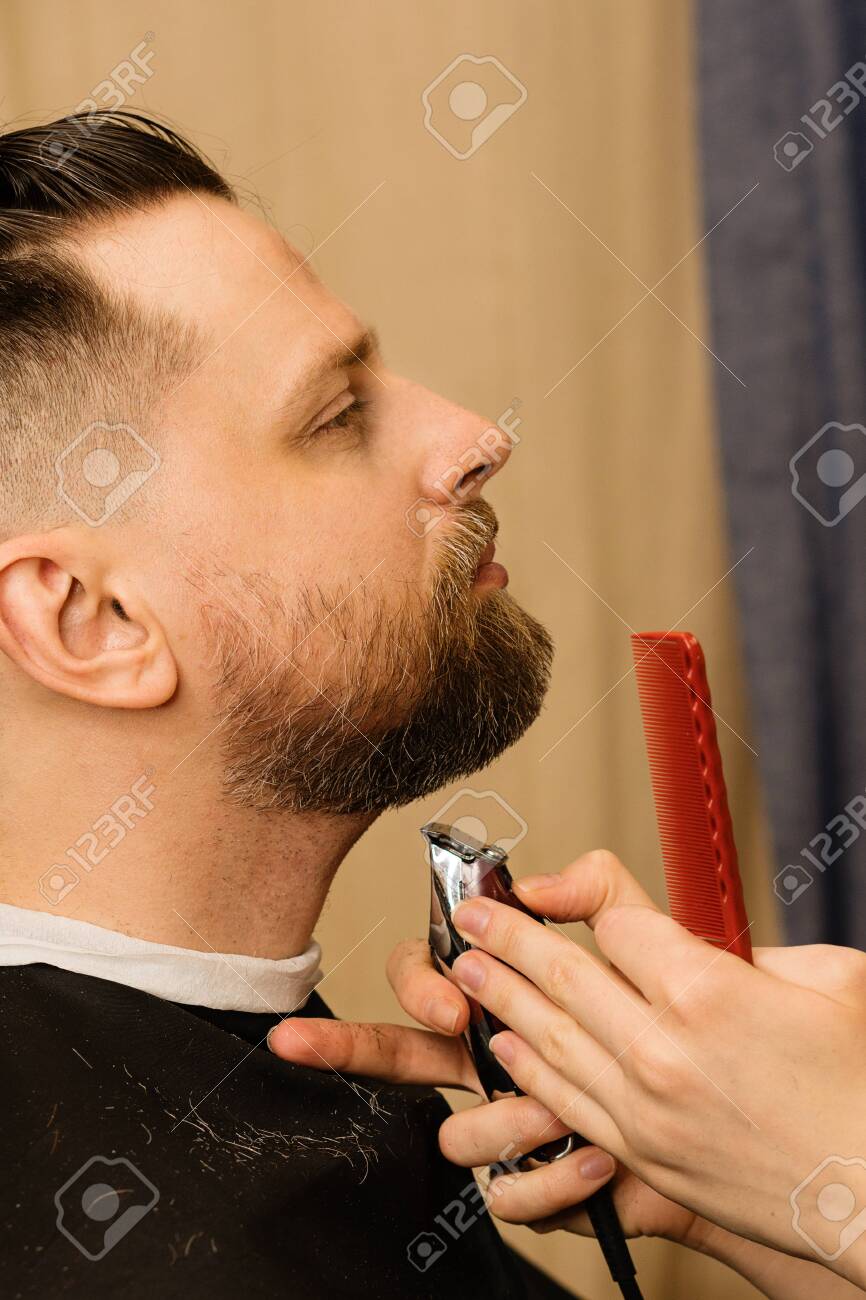 trimming beard with electric razor