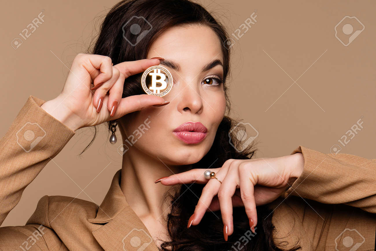 Cryptocurrency And Blockchain Girl Shows Btc Coin Holding In Front Of Eye  Woman Holding Golden Bitcoin And Looking At Camera Advertise Of Digital  Money Btc Coin For E Commerce And Nft Projects