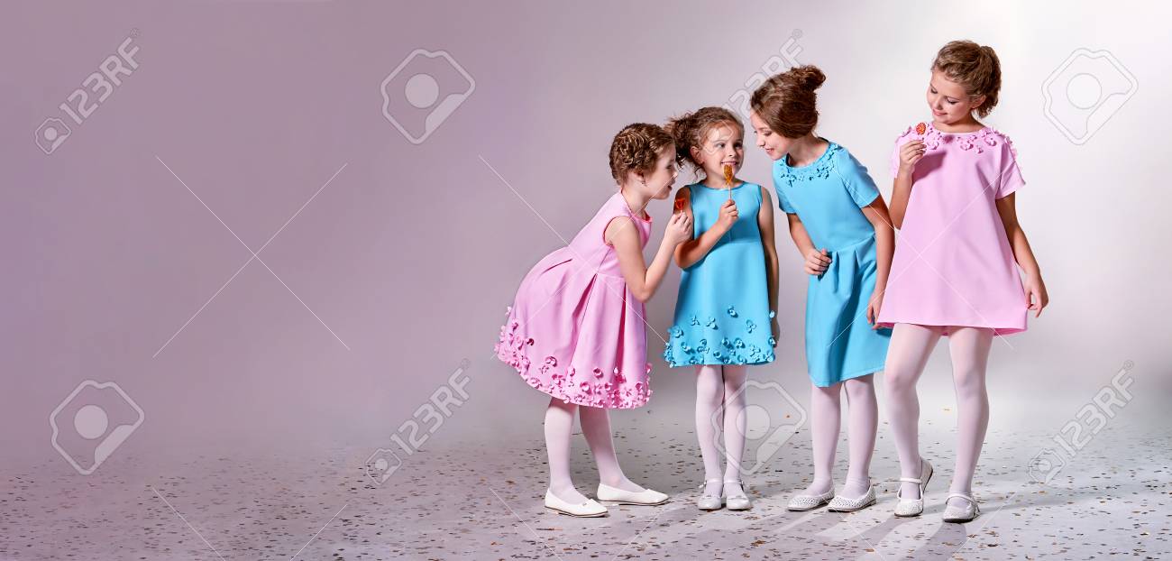 Group little girl in beautiful pink,blue dresses.Four children..