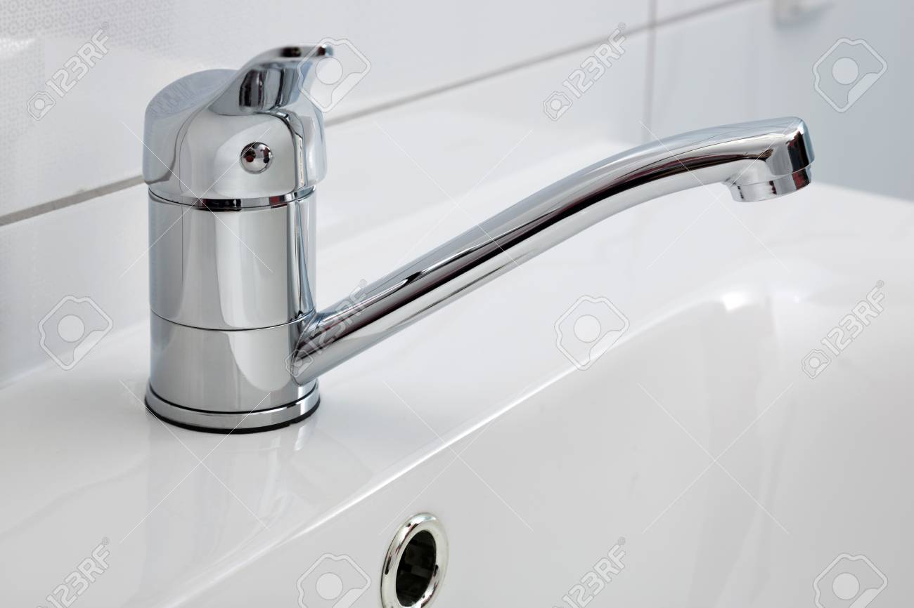 a modern bathroom faucet close up installed on the sink stock photo 90153070 - Modern Bathroom Faucets a modern bathroom faucet close up installed on the sink stock photo 90153070 - Modern Bathroom Faucets