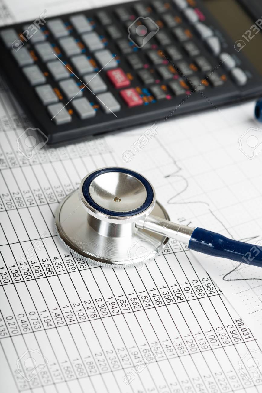 Health care costs. Stethoscope and calculator symbol for health care costs or medical insurance - 33214435 Health care costs. Stethoscope and calculator symbol for health care costs or medical insurance - 33214435