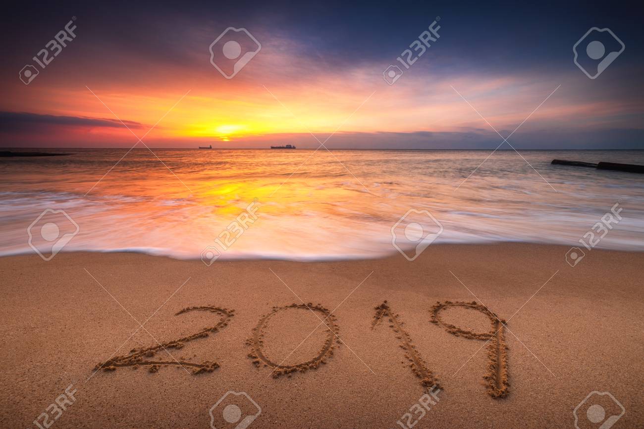 happy new year 2019 concept lettering on the beach sea sunrise