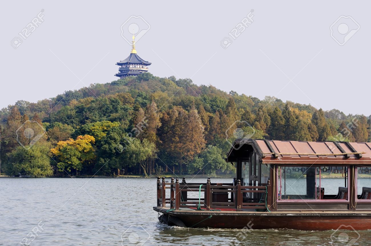 Traditional boat at the West Lake (Xihu) near Hangzhou in China. At the background a pagoda - 4263352 Traditional boat at the West Lake (Xihu) near Hangzhou in China. At the background a pagoda - 4263352