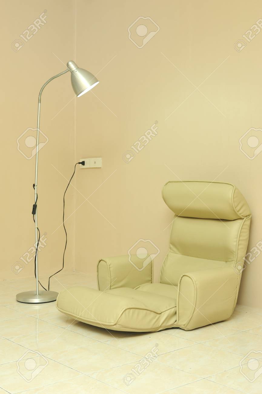 Cushion Seat For Sitting On The Floor With Lamp Over Light Beige