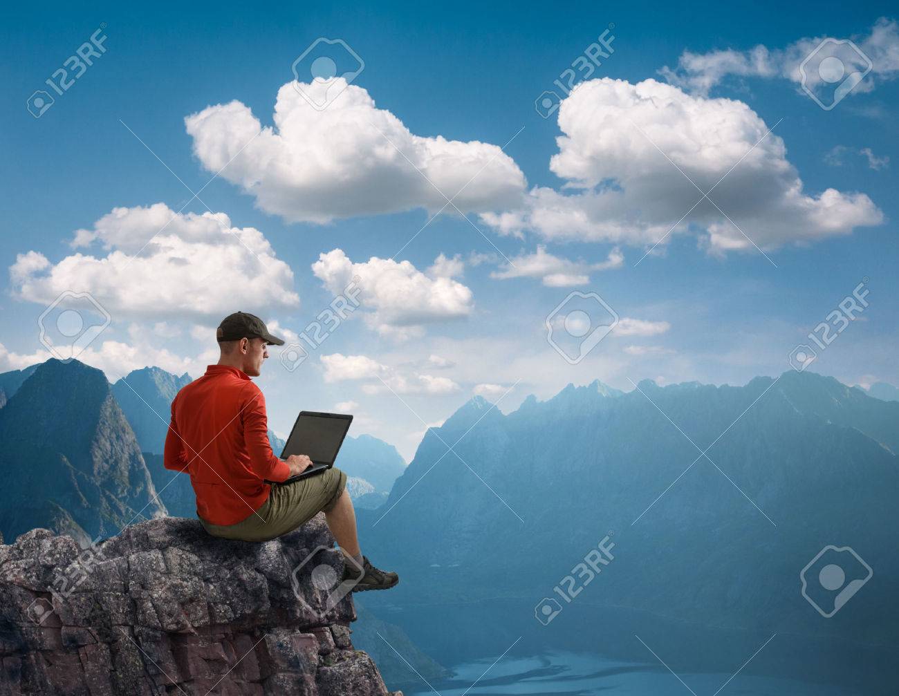 man working outdoors with laptop - 42505080 man working outdoors with laptop - 42505080
