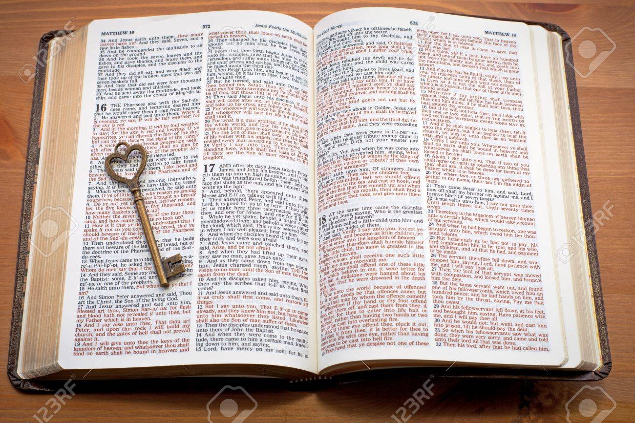 keys to the kingdom key on the open bible stock photo picture and