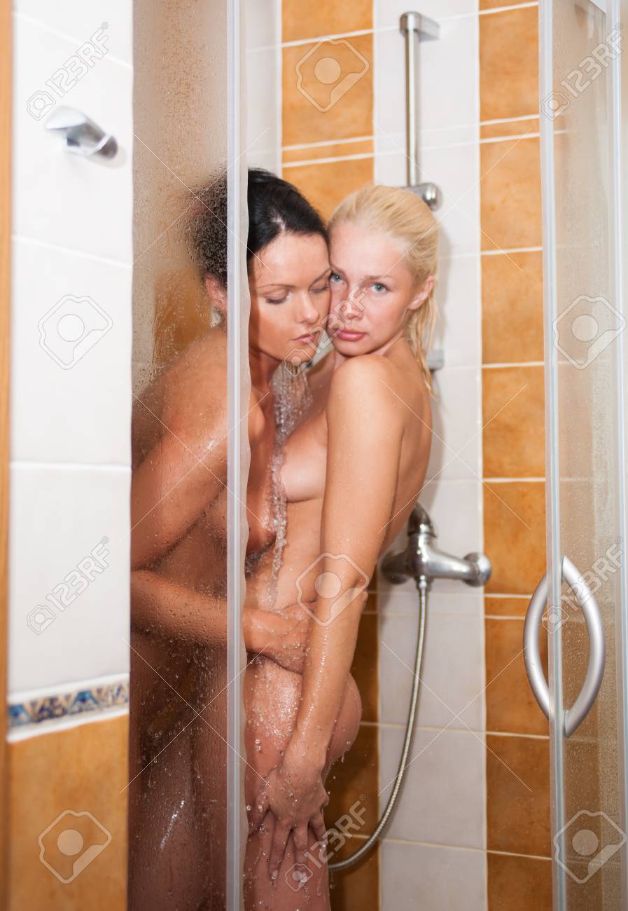 Two Young Nude Women Posing In The Shower Stock Photo, Picture and Royalty  Free Image. Image 98870448.