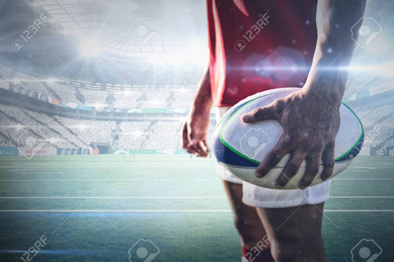 Jogador de rugby que corre com a bola
