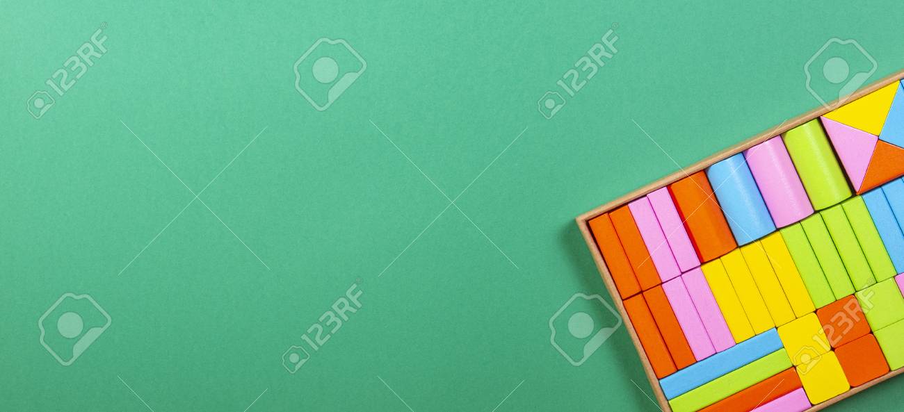 colorful wooden blocks in the box on green background ロイヤリティー