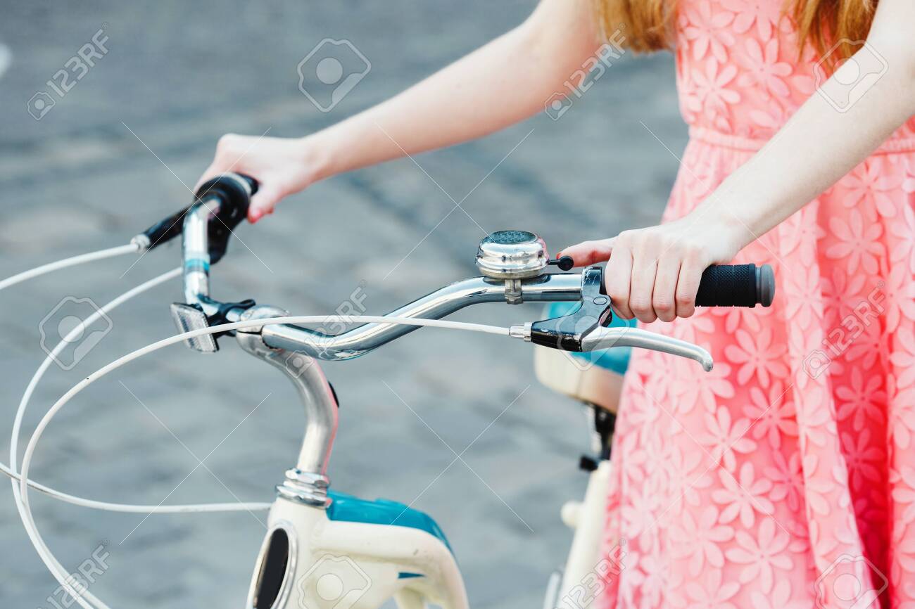 hands of a girl on bicycle handlebar - 122488768 hands of a girl on bicycle handlebar - 122488768