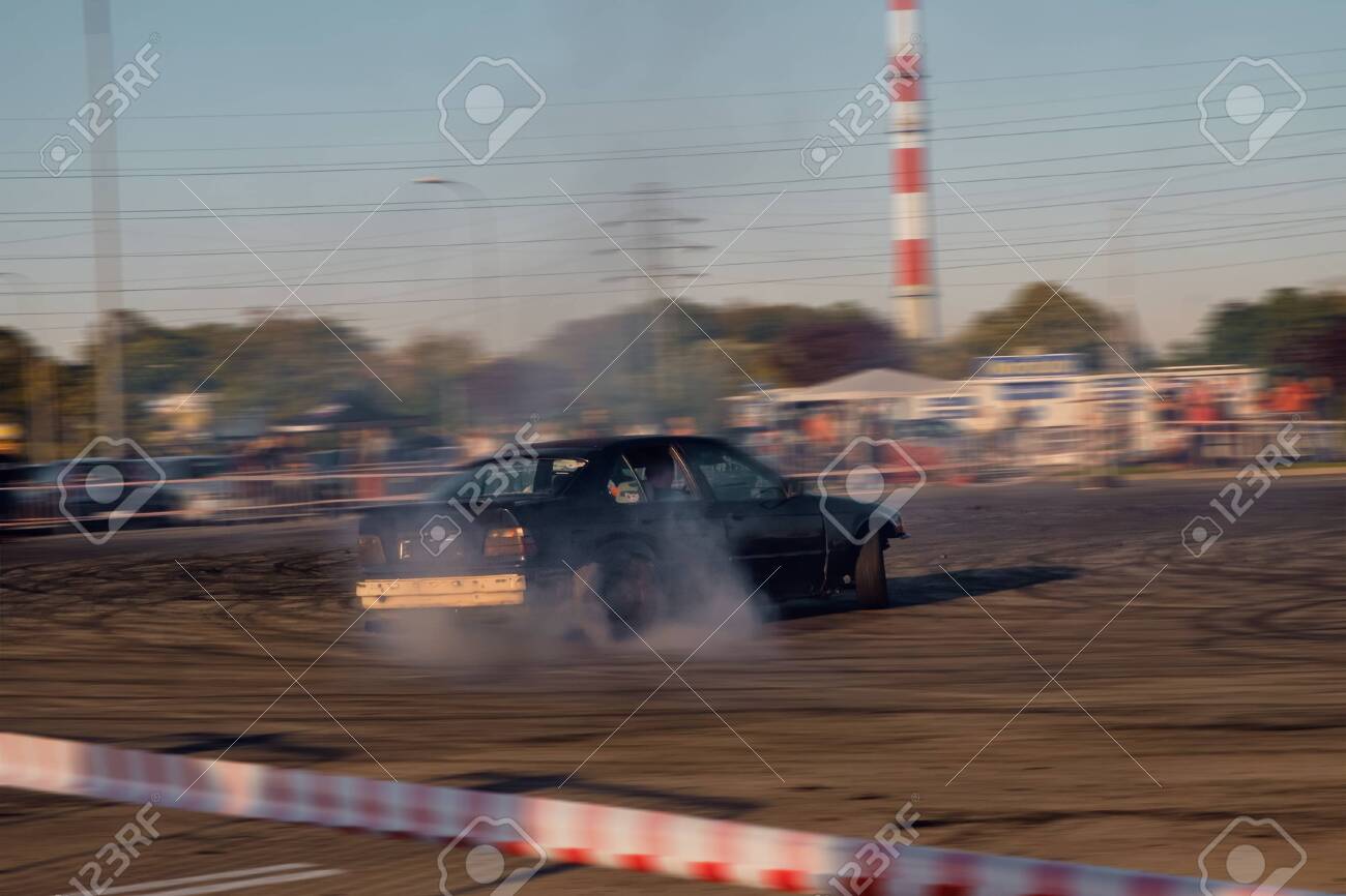 Premium AI Image  Car drifting Blurred image diffusion race drift car with  lots of smoke from burning tires on track