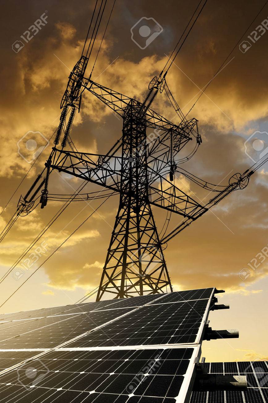Solar panels with electricity pylon at sunset. Clean energy concept. - 47183936 Solar panels with electricity pylon at sunset. Clean energy concept. - 47183936