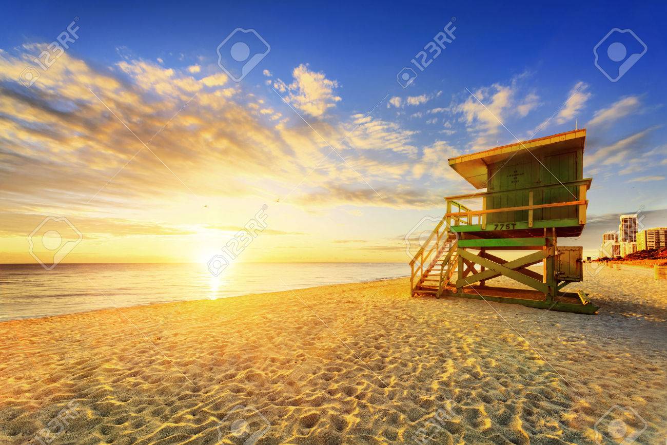 Miami South Beach sunrise with lifeguard tower and coastline with colorful cloud and blue sky. - 39267521 Miami South Beach sunrise with lifeguard tower and coastline with colorful cloud and blue sky. - 39267521