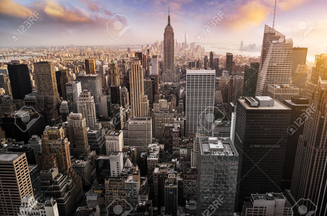 New York City skyline with urban skyscrapers at sunset, USA. - 56795824 New York City skyline with urban skyscrapers at sunset, USA. - 56795824