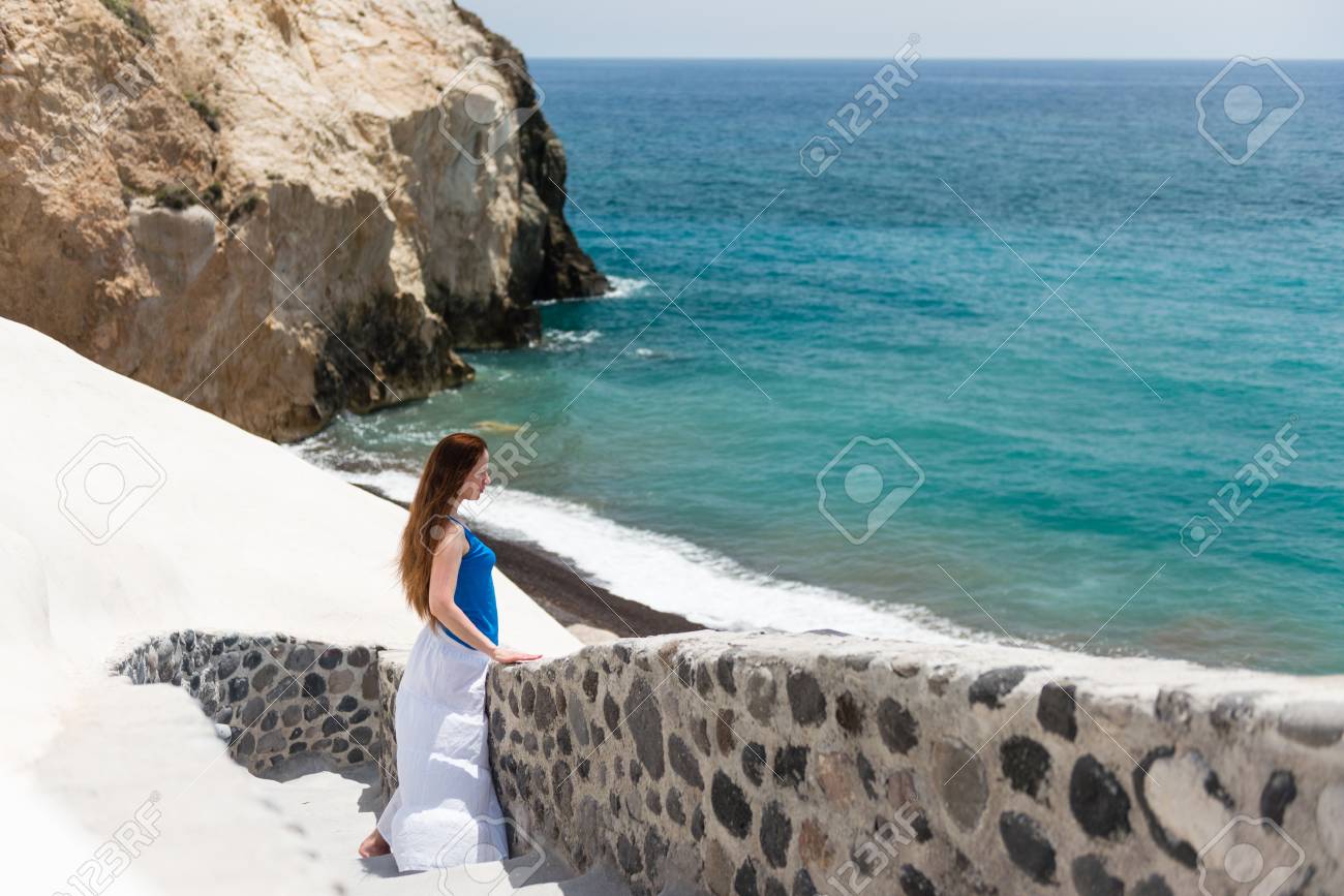 Young Woman On The Stairs Down To The White Beach Santorini Stock Photo Picture And Royalty Free Image Image 88210309