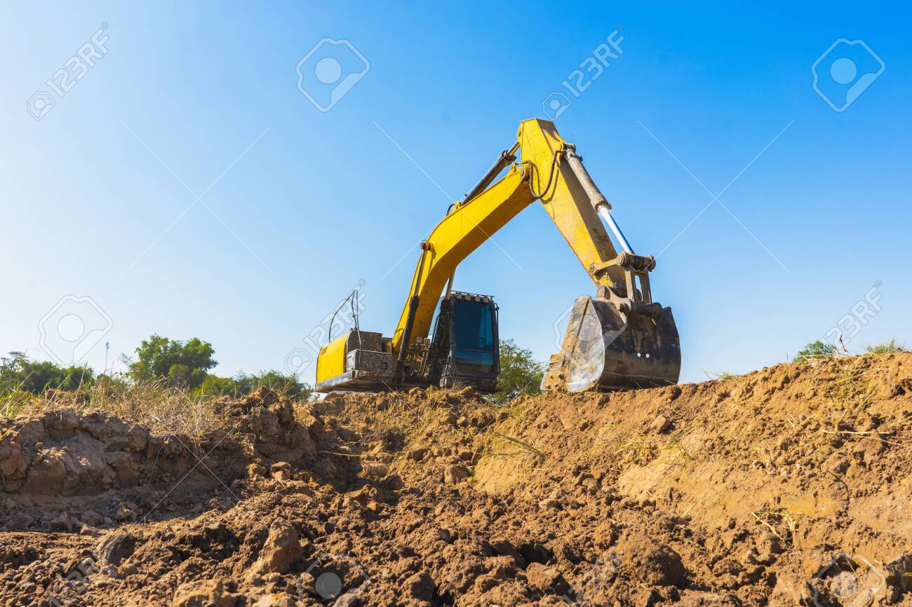 Backhoe Digging Up Soil To Prepare Agricultural Land. Excavator Is Digging  A Hole To Find Water For Agriculture. Crawler Excavator Performs Earth  Work. Stock Photo, Picture And Royalty Free Image. Image 140647904.