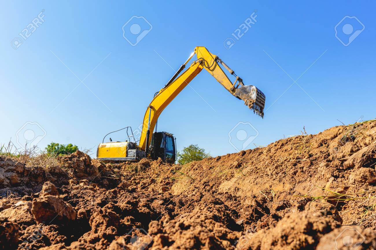 Backhoe Digging Up Soil To Prepare Agricultural Land. Excavator Is Digging  A Hole To Find Water For Agriculture. Crawler Excavator Performs Earth  Work. Stock Photo, Picture And Royalty Free Image. Image 140648088.