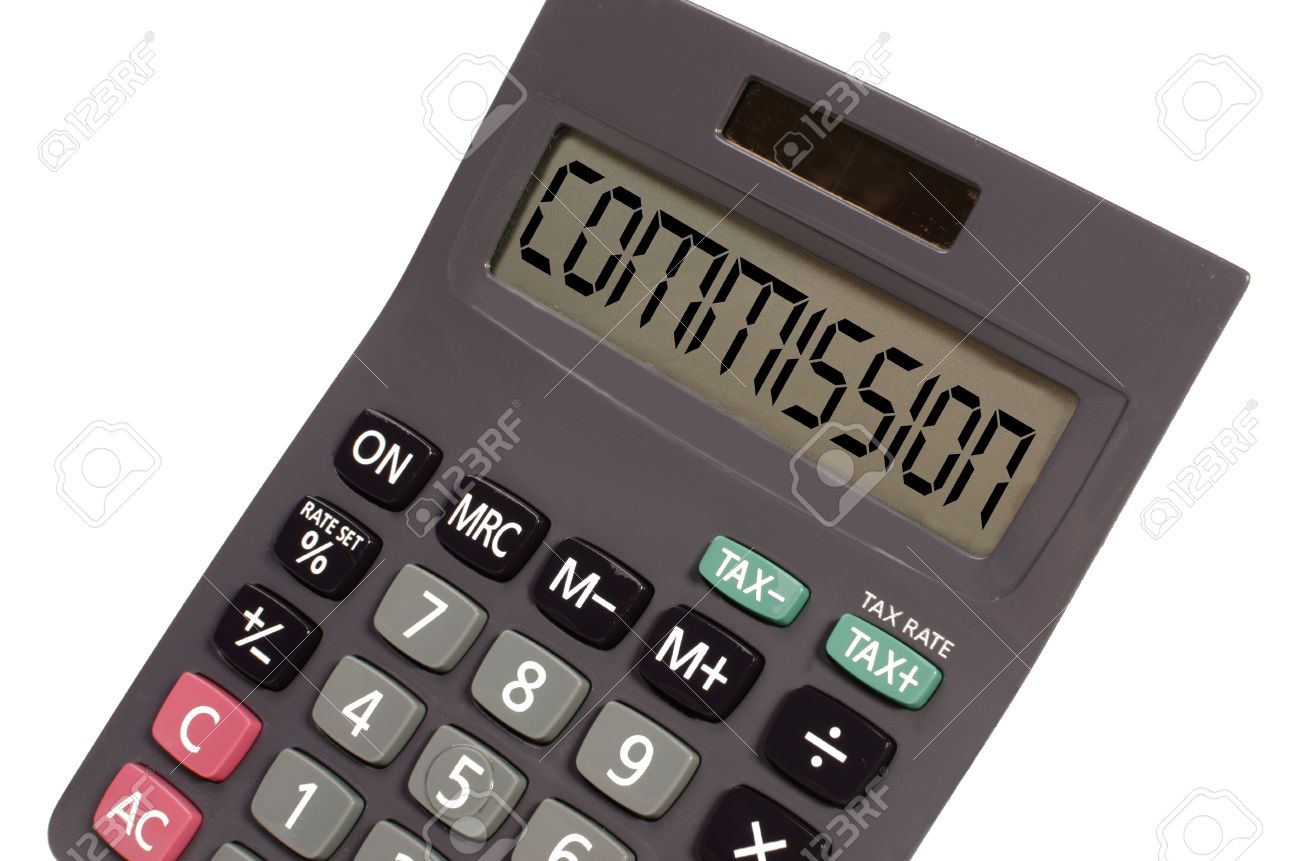 commision written on display of an old calculator on white