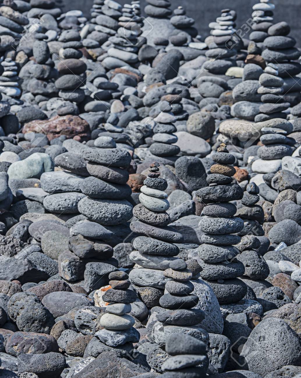 stacks towers from pebbles on the beach stock photo picture and