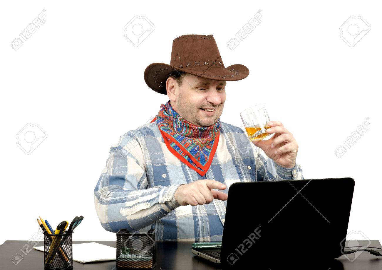 Cowboy Watching Something Funny On The Internet On His Laptop Stock Photo Picture And Royalty Free Image Image