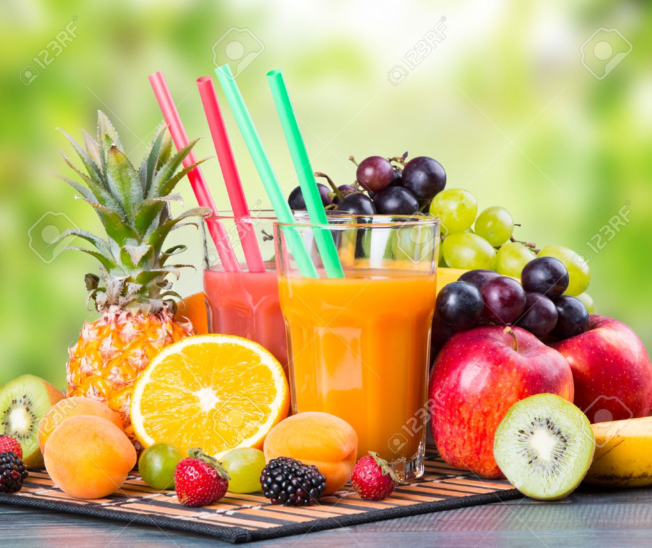 Fresh juice with fruits on wooden table with nature green background - 44154183 Fresh juice with fruits on wooden table with nature green background - 44154183