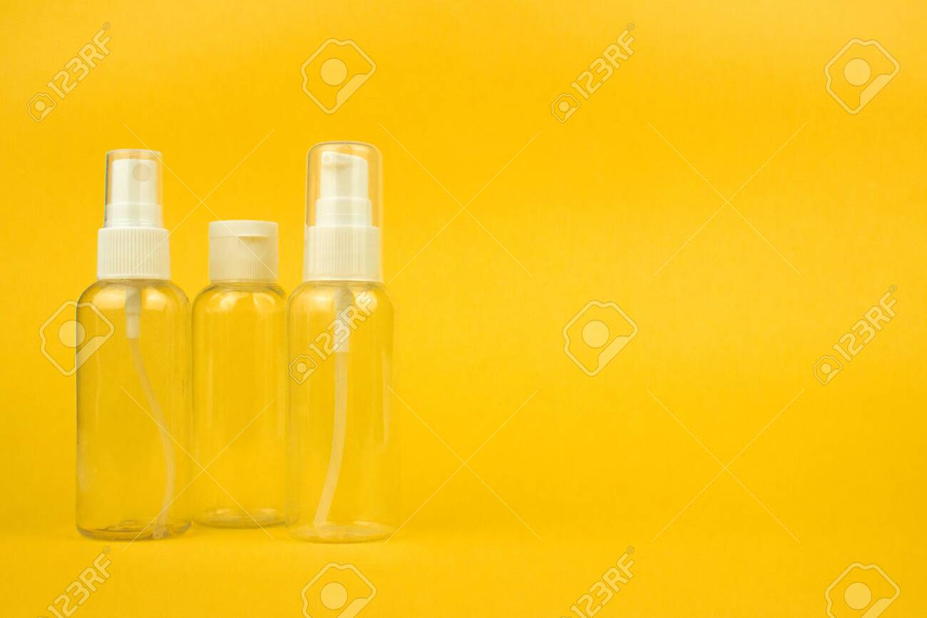 Download Empty Cosmetic Plastic Bottles With Pump And Spray On Yellow Stock Photo Picture And Royalty Free Image Image 137524226