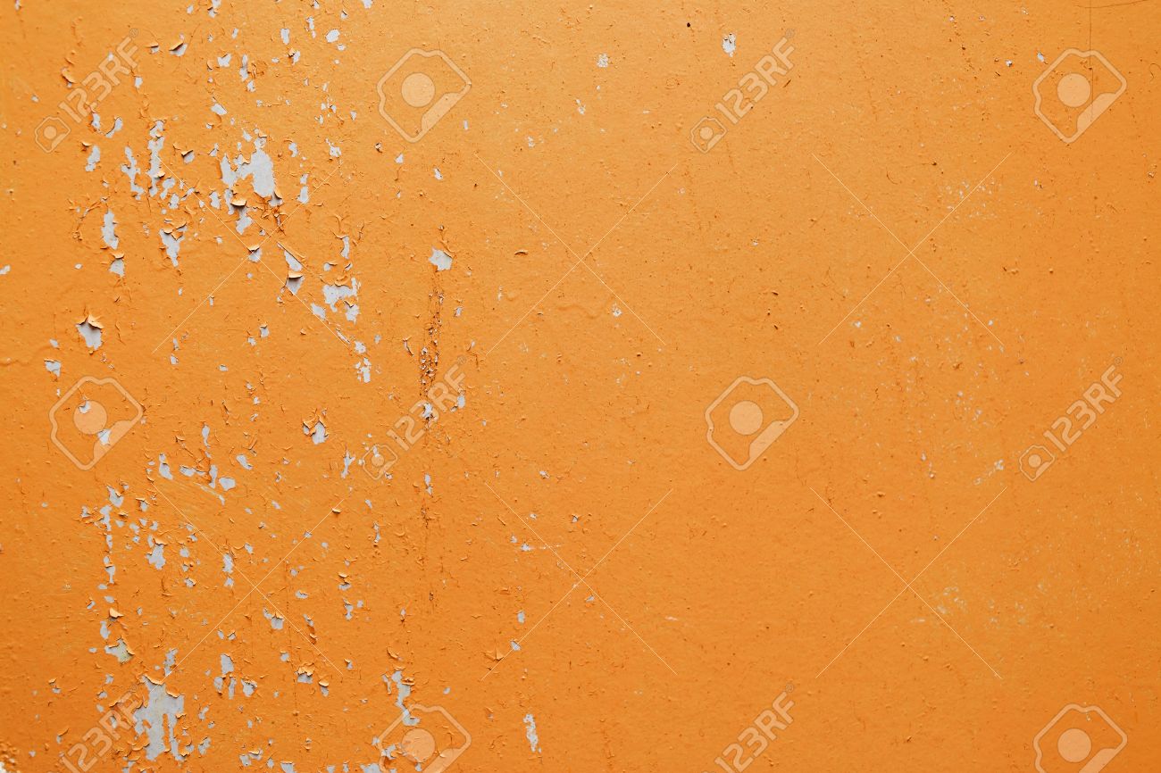 Bright Orange Paint a fragment of the old wall, painted bright orange paint, cracked Bright Orange Paint a fragment of the old wall, painted bright orange paint, cracked