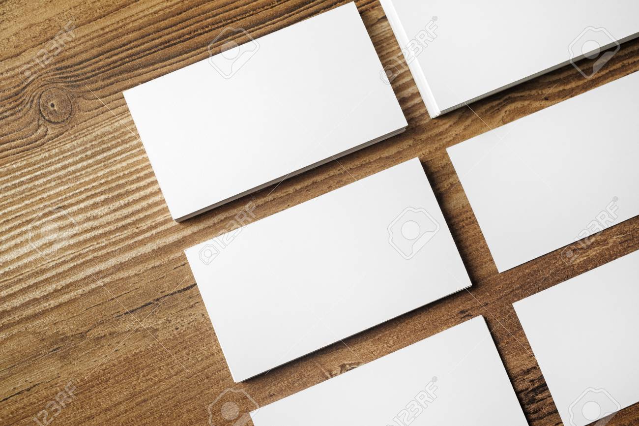 photo of blank business cards on wooden table background blank