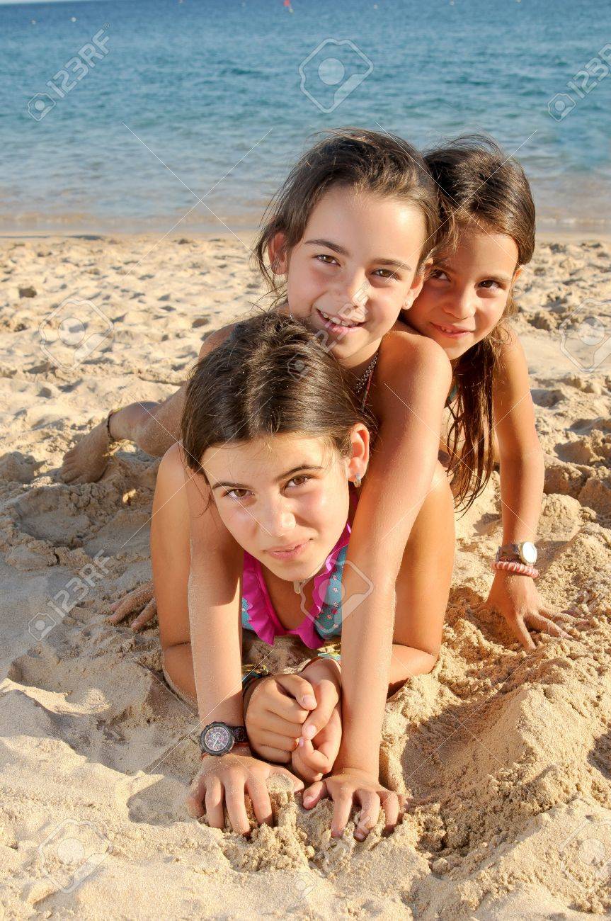 Little Girls On The Beach Stock Photo, Picture and Royalty Free Image.  Image 21382506.