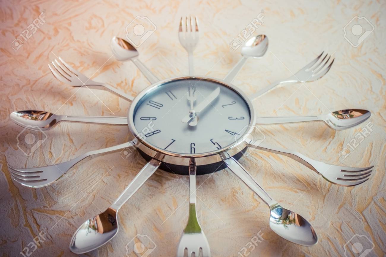 On The Kitchen Clock Lunch Time The Dial Is Decorated With