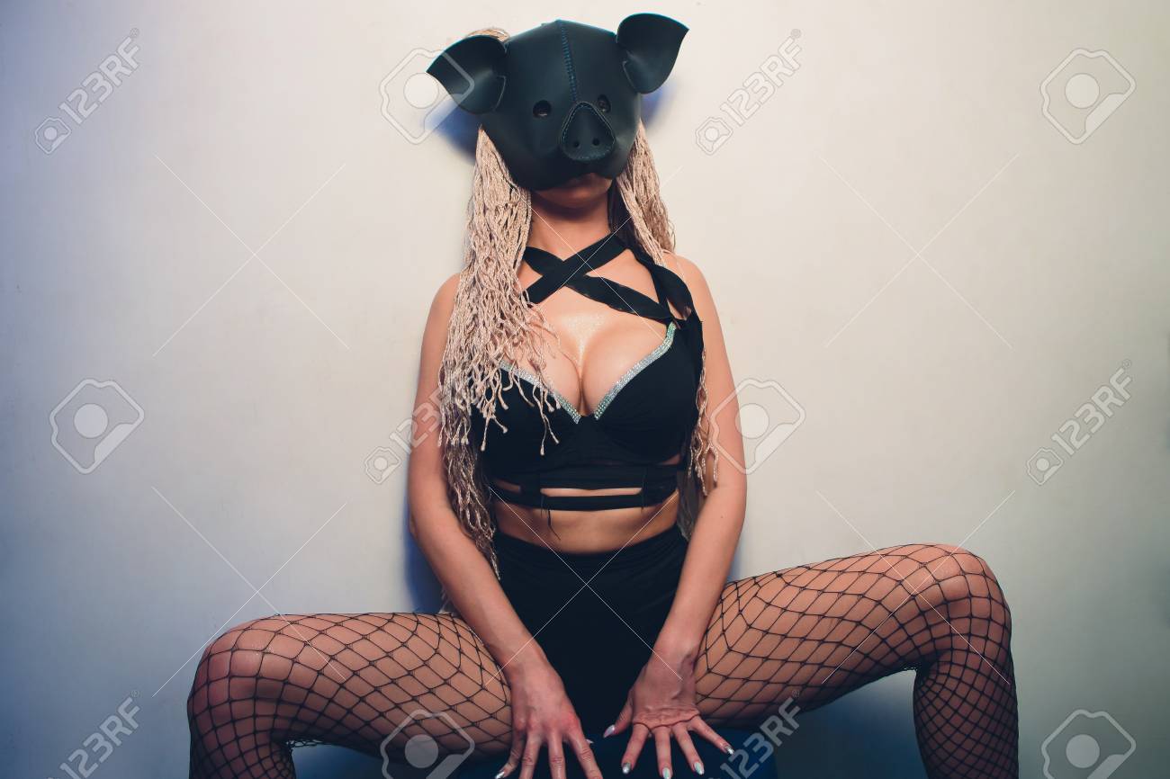 Stock Photo - Swine mascot costume dance striptease woman in black leather pig mask. Swine Mascot Costume Dance Striptease Woman In Black Leather.. Stock ...