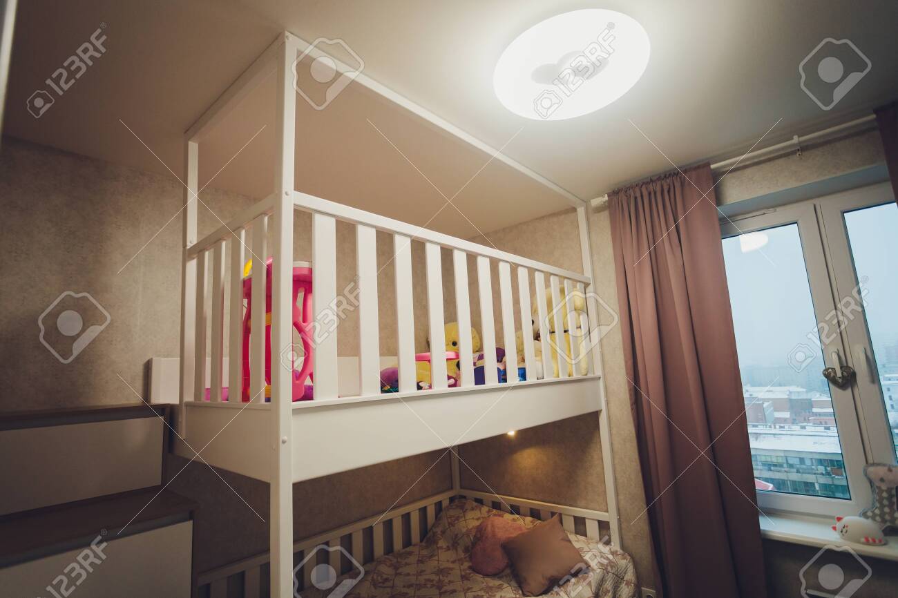 white wooden childrens bed