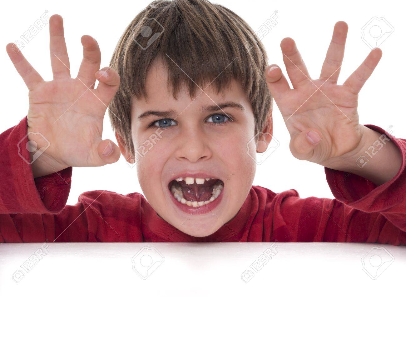 Boy Trying To Scare Someone Stock Photo, Picture and Royalty Free Image.  Image 18032834.