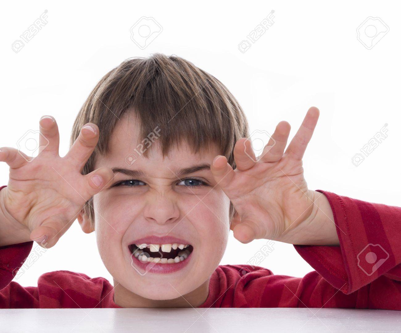 A Boy Trying To Scare Someone Stock Photo, Picture and Royalty Free Image.  Image 19421154.