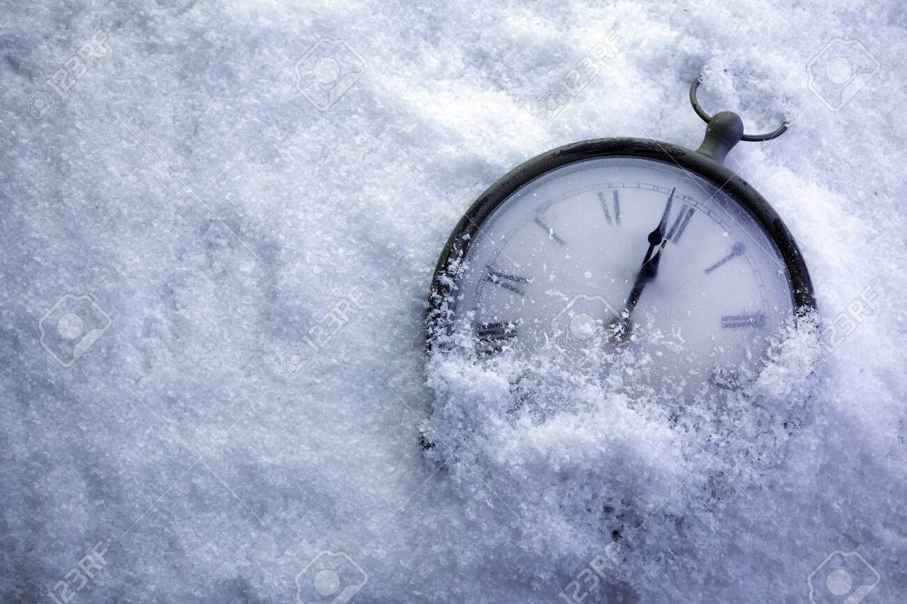 Christmas Time Clock under white snow, countdown to midnight - 135675670 Christmas Time Clock under white snow, countdown to midnight - 135675670