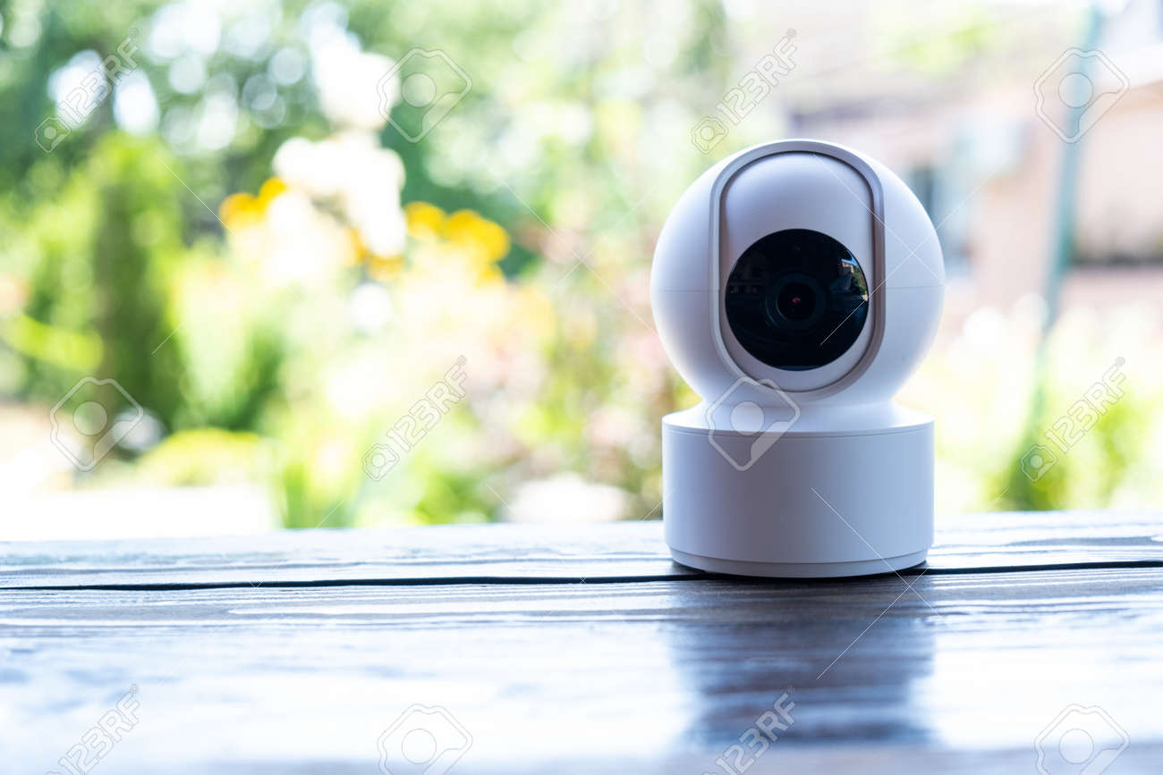 Video surveillance equipment on the table. Compact security camera for outdoor or private home security - 171471718 Video surveillance equipment on the table. Compact security camera for outdoor or private home security - 171471718