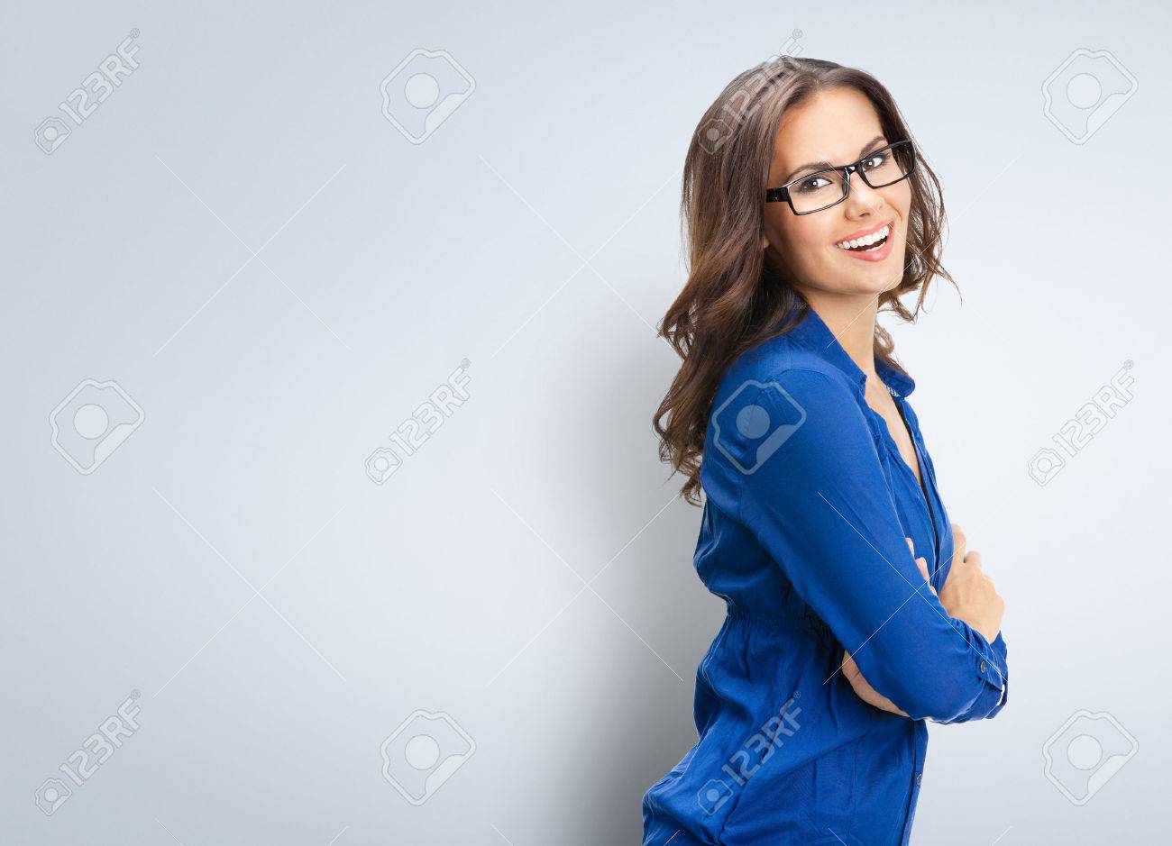 Portrait of smiling young businesswoman in glasses, with blank copyspace area for slogan or text - 40543353 Portrait of smiling young businesswoman in glasses, with blank copyspace area for slogan or text - 40543353